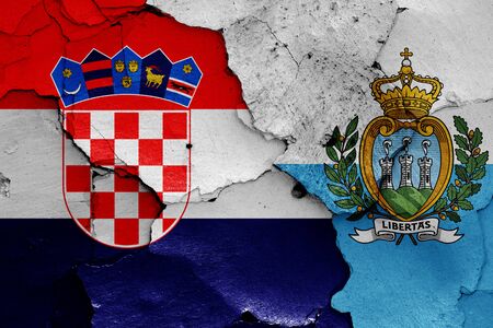 flags of Croatia and San Marino painted on cracked wallの写真素材