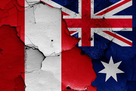 flags of Peru and Australia painted on cracked wallの写真素材