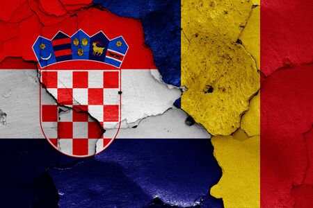flags of Croatia and Romania painted on cracked wallの写真素材