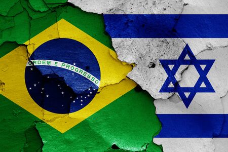 flags of Brazil and Israel painted on cracked wallの写真素材