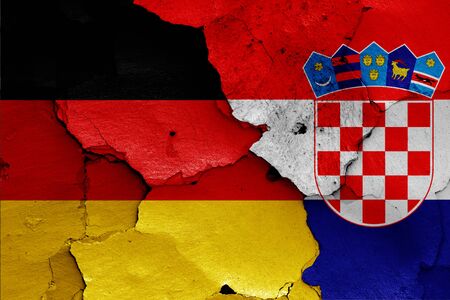 flags of Germany and Croatia painted on cracked wallの写真素材