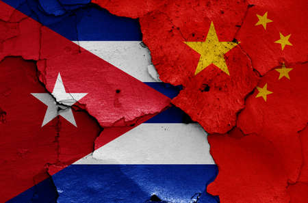 flags of Cuba and China painted on cracked wallの写真素材