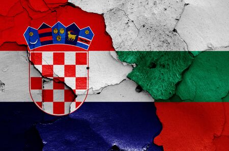 flags of Croatia and Bulgaria painted on cracked wallの写真素材