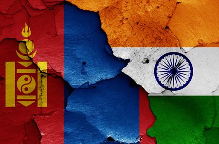 flags of Mongolia and India painted on cracked wallの写真素材