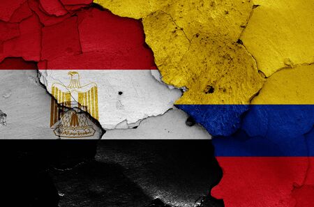 flags of Egypt and Colombia painted on cracked wallの写真素材