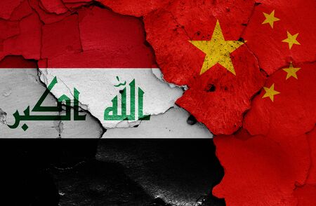 flags of Iraq and China painted on cracked wallの写真素材
