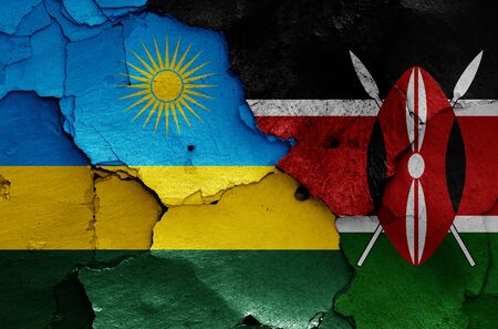 flags of Rwanda and Kenya painted on cracked wallの写真素材