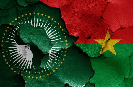 flags of African Union and Burkina Faso painted on cracked wallの写真素材