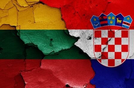 flags of Lithuania and Croatia painted on cracked wallの写真素材