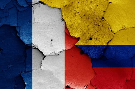 flags of France and Colombia painted on cracked wallの写真素材