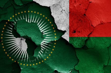flags of African Union and Madagascar painted on cracked wallの写真素材