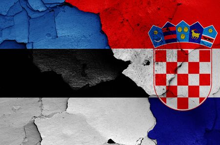 flags of Estonia and Croatia painted on cracked wallの写真素材