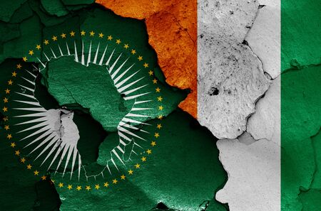 flags of African Union and Ivory Coast painted on cracked wallの写真素材