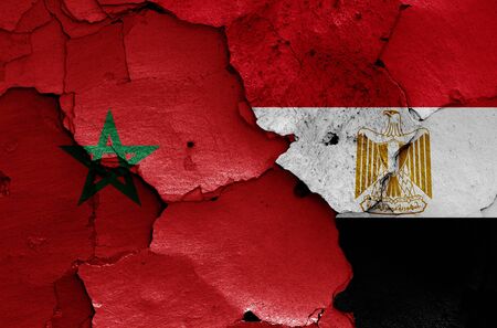 flags of Morocco and Egypt painted on cracked wallの写真素材