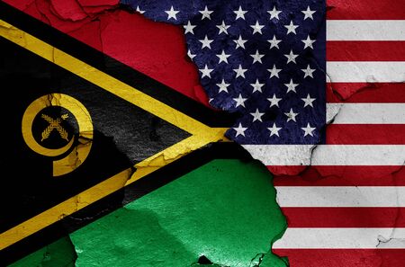 flags of Vanuatu and USA painted on cracked wallの写真素材
