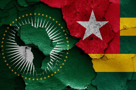 flags of African Union and Togo painted on cracked wallの写真素材
