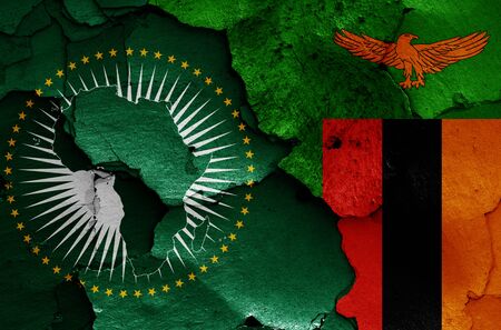 flags of African Union and Zambia painted on cracked wallの写真素材