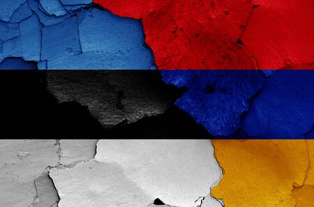 flags of Estonia and Armenia painted on cracked wallの写真素材