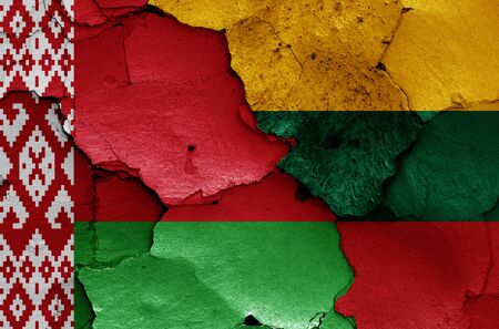 flags of Belarus and Lithuania painted on cracked wallの写真素材
