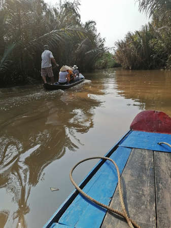 Mekong Delta, Vietnam - February 26, 2020: The Mekong Delta in Vietnam is a vast maze of rivers, swamps and islands, floating markets. Boats are the main means of transportation.のeditorial素材