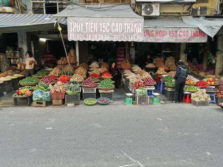 Hanoi, Vietnam - February 26, 2020: fresh fruits and vegetables vendor sellers in Hanoiのeditorial素材