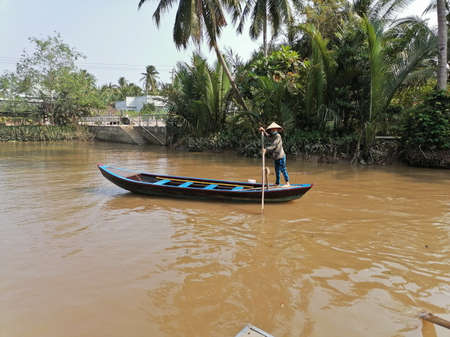 Mekong Delta, Vietnam - February 26, 2020: The Mekong Delta in Vietnam is a vast maze of rivers, swamps and islands, floating markets. Boats are the main means of transportation.のeditorial素材