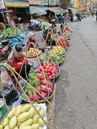 Hanoi, Vietnam - February 26, 2020: fresh fruits and vegetables street sellers in Hanoiのeditorial素材