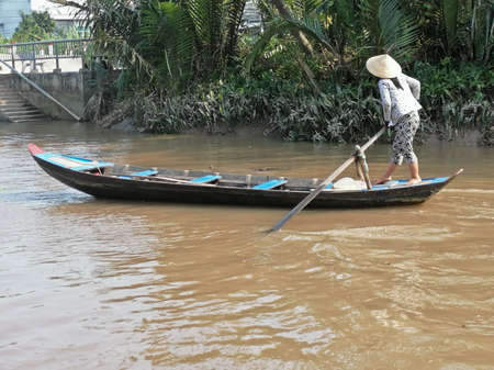 Mekong Delta, Vietnam - February 26, 2020: The Mekong Delta in Vietnam is a vast maze of rivers, swamps and islands, floating markets. Boats are the main means of transportation.のeditorial素材