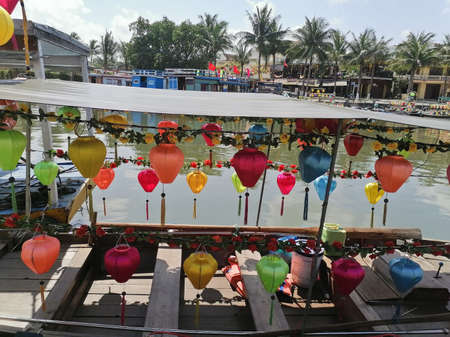 Hoi An, Vietnam - February 26, 2020 : wooden boats with colorful lanterns on the riverのeditorial素材
