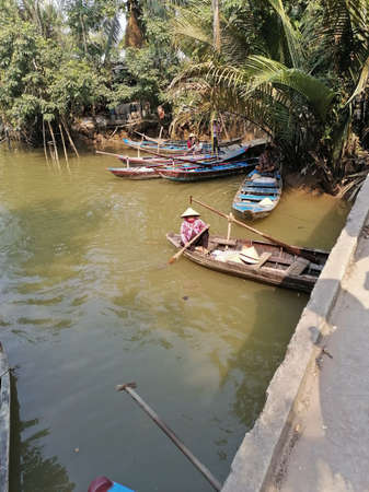 Mekong Delta, Vietnam - February 26, 2020: The Mekong Delta in Vietnam is a vast maze of rivers, swamps and islands, floating markets. Boats are the main means of transportation.のeditorial素材