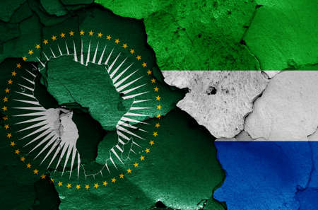 flags of African Union and Sierra Leone painted on cracked wallの写真素材