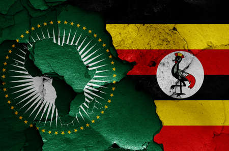 flags of African Union and Uganda painted on cracked wallの写真素材