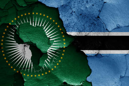 flags of African Union and Botswana painted on cracked wallの写真素材