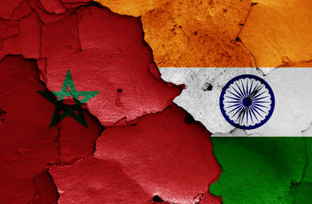 flags of Morocco and India painted on cracked wallの写真素材