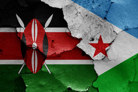 flags of Kenya and Djibouti painted on cracked wallの写真素材