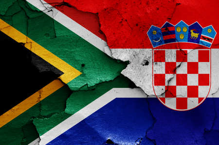 flags of South Africa and Croatia painted on cracked wallの写真素材