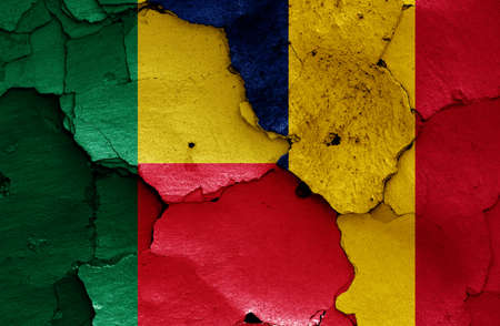 flags of Benin and Chad painted on cracked wallの写真素材