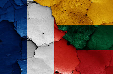 flags of France and Lithuania painted on cracked wallの写真素材