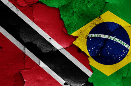 flags of Trinidad and Tobago and Brazil painted on cracked wallの写真素材