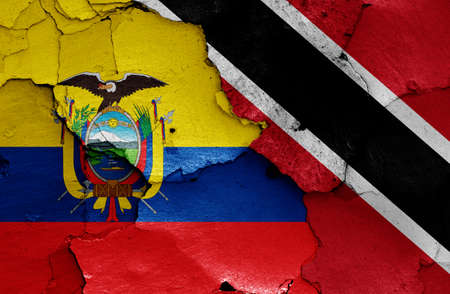 flags of Ecuador and Trinidad and Tobago painted on cracked wallの写真素材