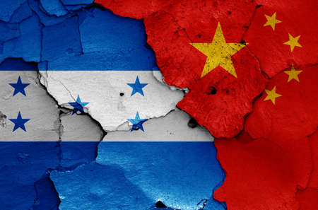 flags of Honduras and China painted on cracked wallの写真素材
