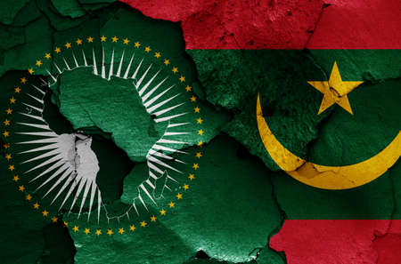flags of African Union and Mauritania painted on cracked wallの写真素材