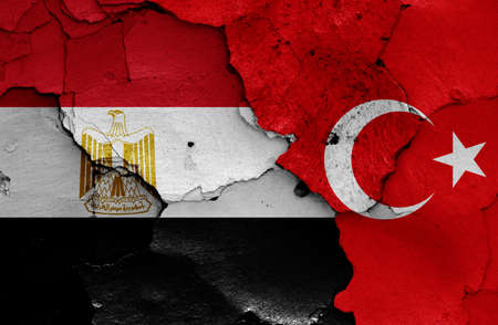Flags of Egypt and Turkey painted on cracked wallの写真素材