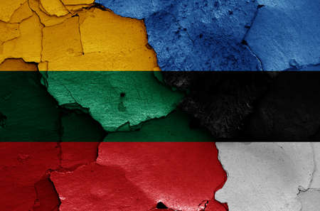 flags of Lithuania and Estonia painted on cracked wallの写真素材