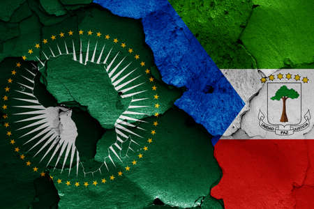 flags of African Union and Equatorial Guinea painted on cracked wallの写真素材