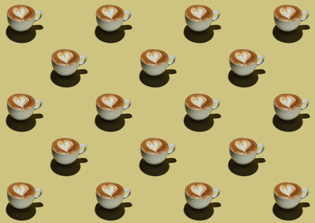 Pattern of a cup of cappuccino on a yellow background with a drawn heart
