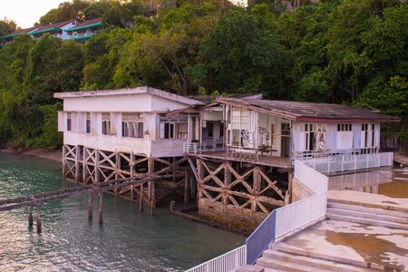 Wooden house on the river. Sunset, summer.の写真素材