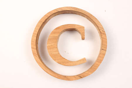 Copyright text from wood letters Holz Buchstaben white Backgroundの写真素材