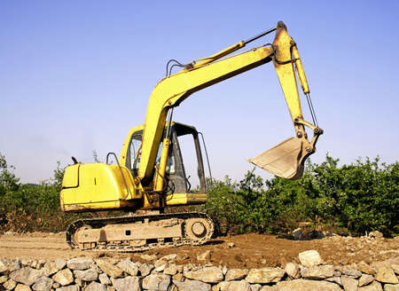 Orange excavator at construction site