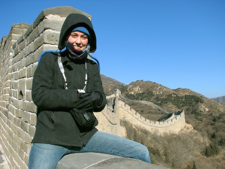 Woman sitting on the Great Wall of China at Badaling, outside of Beijing.の写真素材